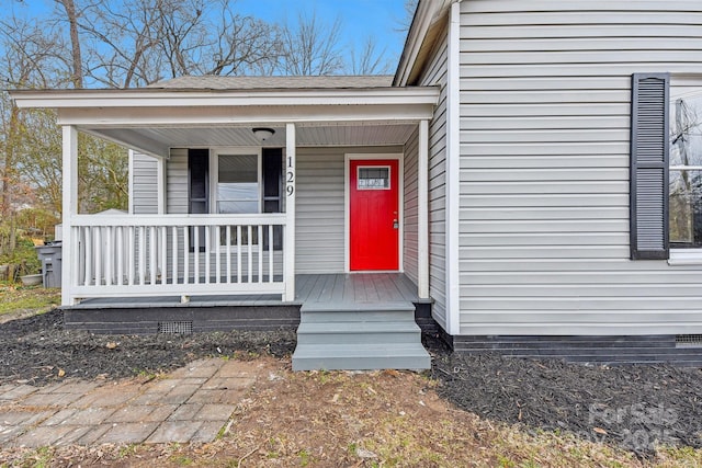 doorway to property with a porch