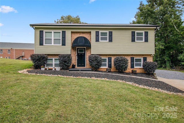 bi-level home with a front lawn