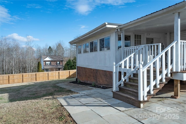 view of property exterior with a patio