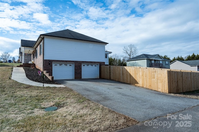 view of side of property with a garage