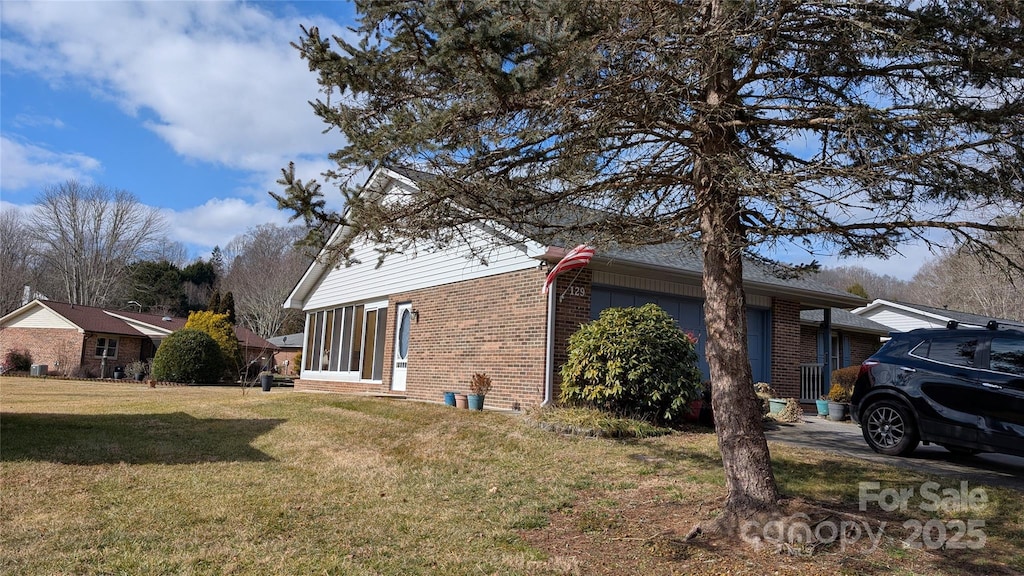 view of property exterior with a lawn