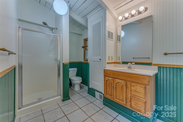 bathroom with toilet, tile patterned flooring, walk in shower, vanity, and lofted ceiling with beams