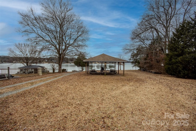 view of yard with a gazebo and a water view