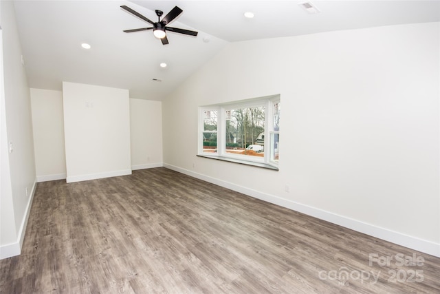 spare room with ceiling fan, hardwood / wood-style flooring, and lofted ceiling