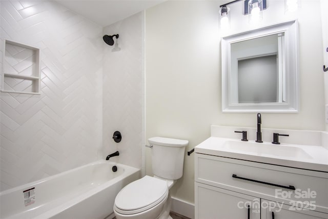 full bathroom with vanity, toilet, and tiled shower / bath