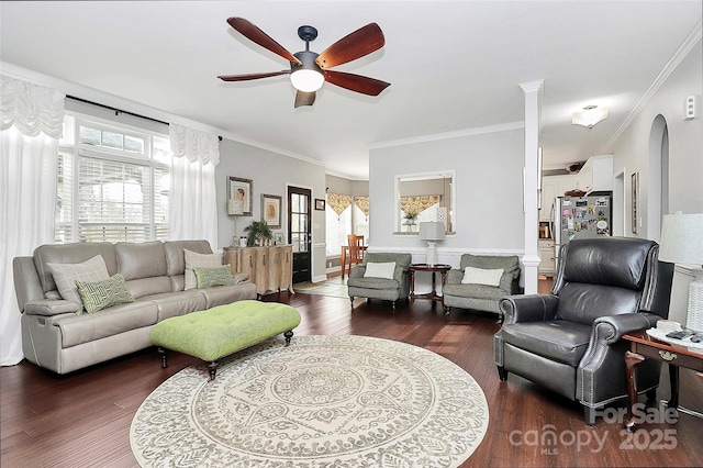 living room featuring crown molding, ceiling fan, a healthy amount of sunlight, and dark hardwood / wood-style flooring