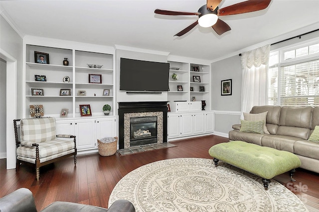 living room with crown molding, ceiling fan, and dark hardwood / wood-style flooring