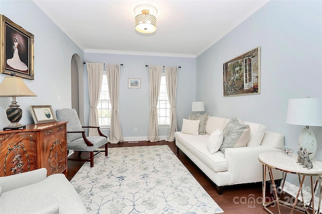 living room with hardwood / wood-style floors and crown molding