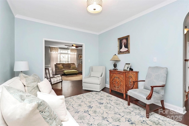 living room with hardwood / wood-style flooring and ornamental molding