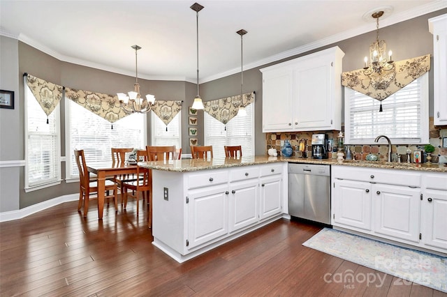 kitchen with white cabinetry, sink, dishwasher, and a chandelier