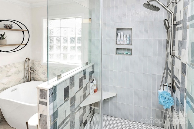 bathroom with tile walls, crown molding, and shower with separate bathtub