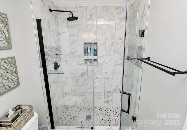 bathroom featuring a shower with door