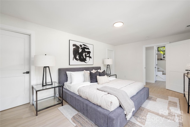 bedroom with light hardwood / wood-style floors