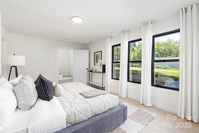 bedroom with light hardwood / wood-style floors