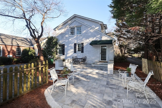 back of property featuring a patio