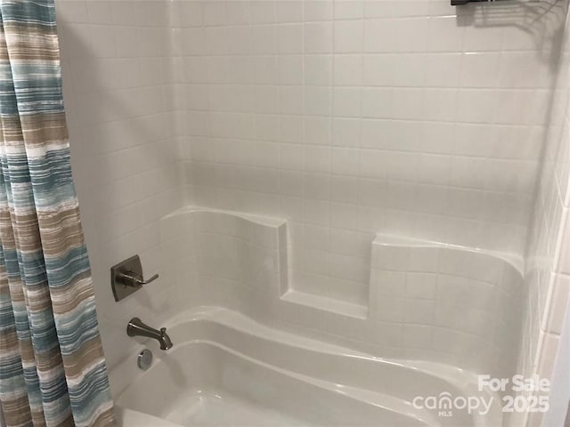 bathroom featuring shower / bath combo with shower curtain