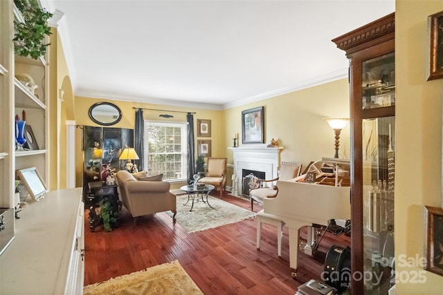 living area with dark wood-type flooring and crown molding