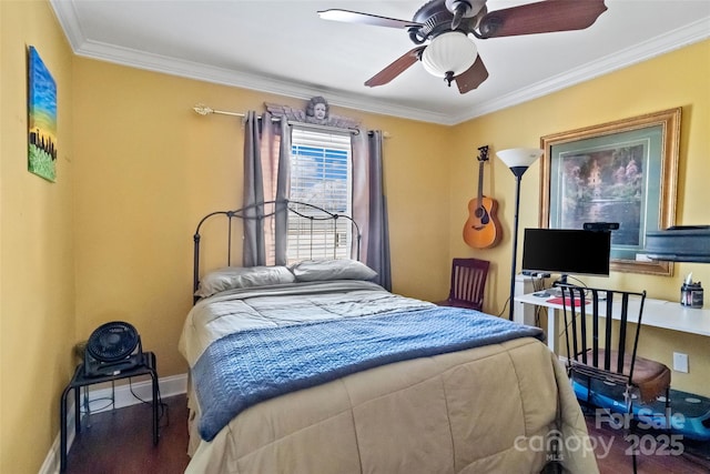 bedroom with hardwood / wood-style flooring, ceiling fan, and ornamental molding