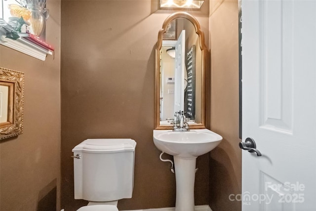 bathroom with sink and toilet