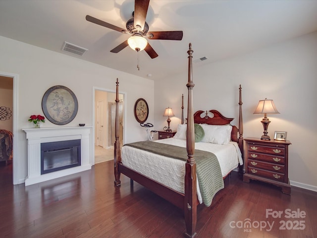 bedroom with ceiling fan and dark hardwood / wood-style flooring