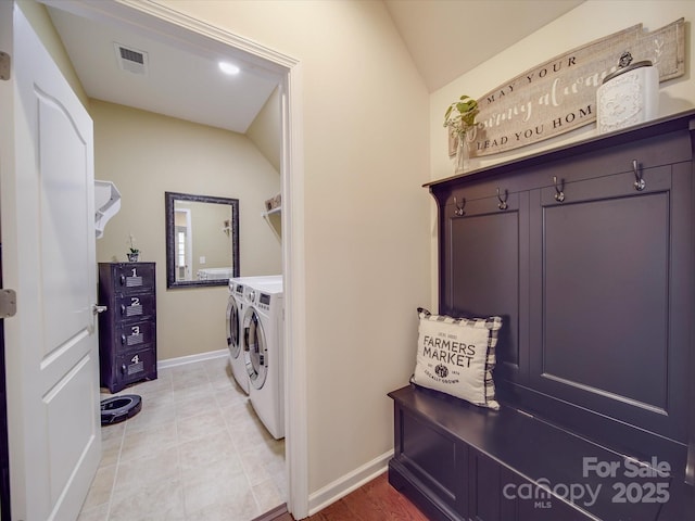 washroom featuring tile patterned flooring and washer and clothes dryer