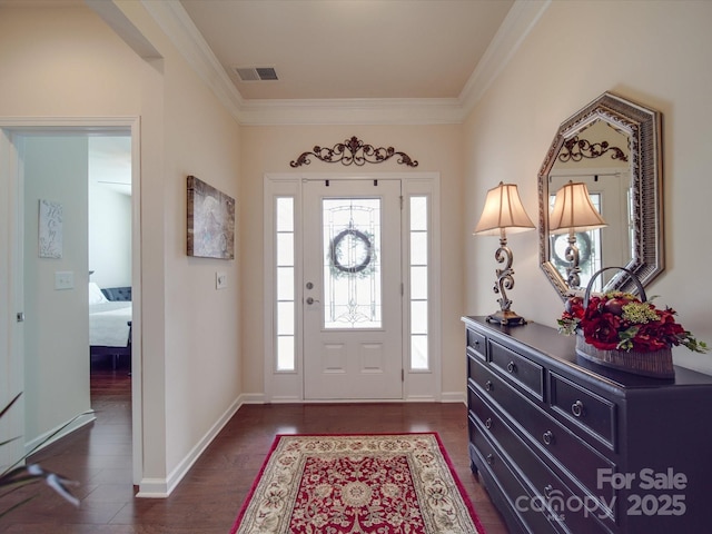 entryway featuring ornamental molding and dark hardwood / wood-style floors