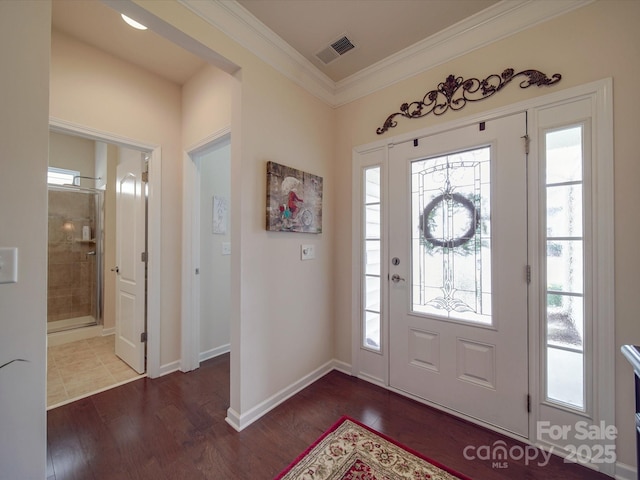 foyer featuring crown molding and dark hardwood / wood-style flooring