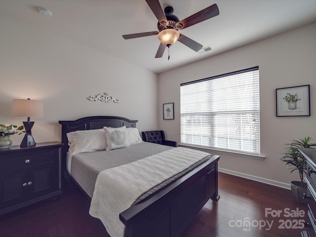 bedroom featuring ceiling fan and dark hardwood / wood-style floors