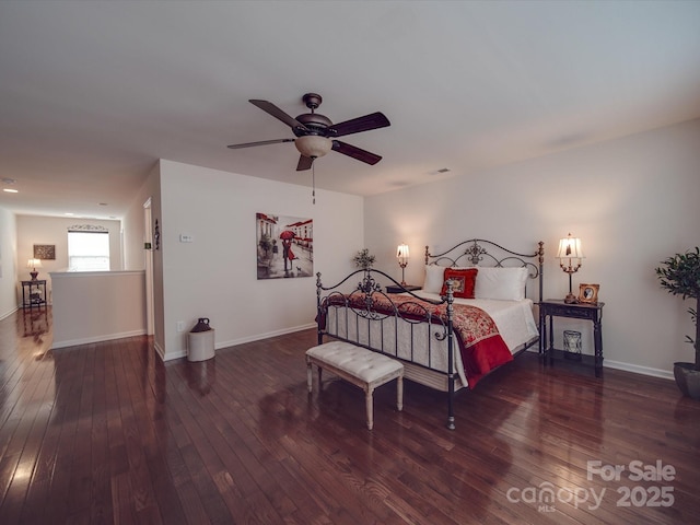 bedroom featuring ceiling fan and dark hardwood / wood-style flooring