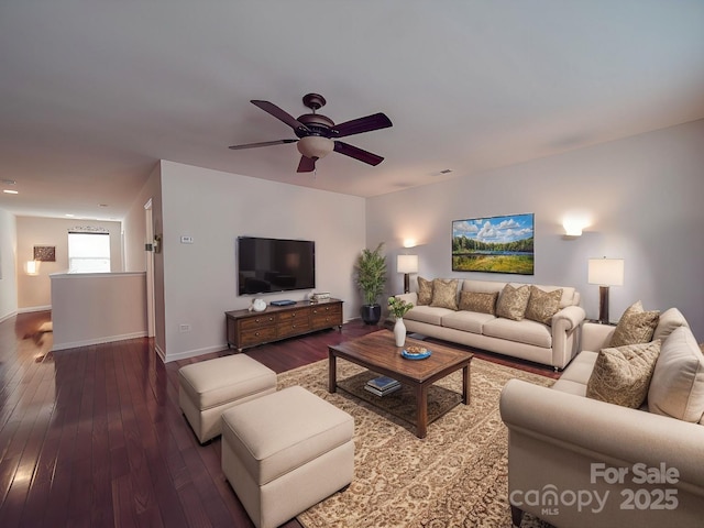 living room with hardwood / wood-style floors and ceiling fan