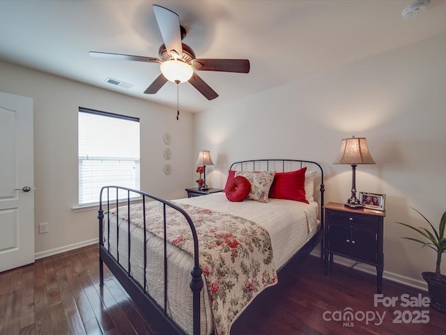 bedroom with dark wood-type flooring and ceiling fan