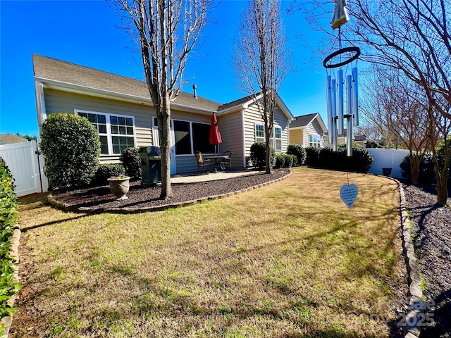 exterior space with a patio and a yard