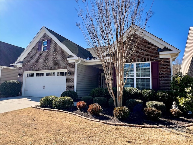 front of property featuring a garage and a front yard