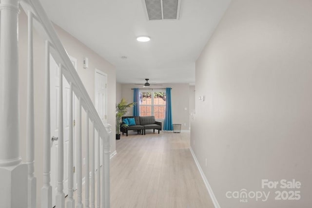 hallway with light wood-type flooring