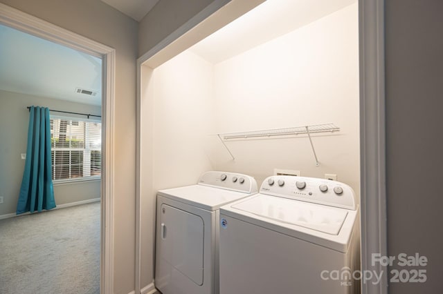 laundry area featuring carpet and washing machine and clothes dryer