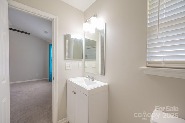 bathroom with vanity and toilet