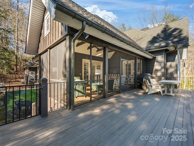 deck with a sunroom