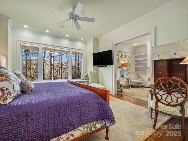 bedroom featuring ceiling fan, crown molding, and hardwood / wood-style flooring