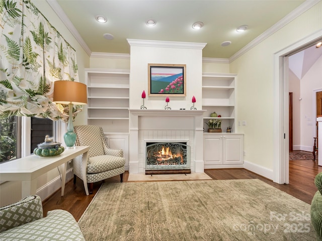 sitting room featuring a fireplace, dark hardwood / wood-style flooring, and ornamental molding