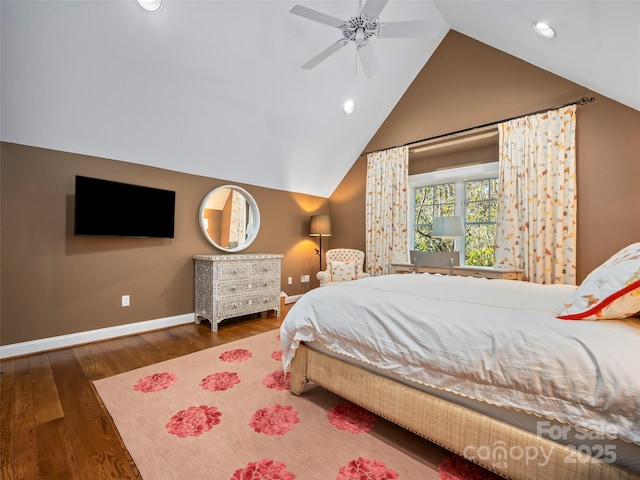 bedroom featuring ceiling fan, dark hardwood / wood-style floors, and lofted ceiling