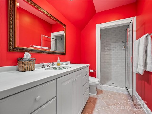 bathroom with toilet, vanity, tile patterned flooring, lofted ceiling, and an enclosed shower