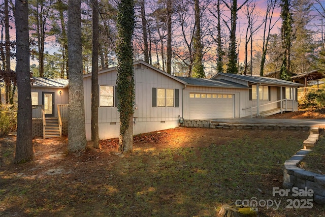 property exterior at dusk featuring a garage