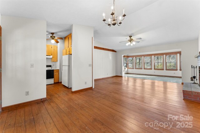 550 Kinross Dr, Flat Rock, NC 28731 - unfurnished living room featuring a fireplace, ceiling fan with notable chandelier, and light hardwood / wood-style flooring