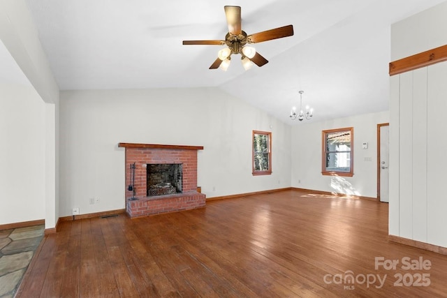 550 Kinross Dr, Flat Rock, NC 28731 - unfurnished living room with a fireplace, wood-type flooring, ceiling fan with notable chandelier, and vaulted ceiling