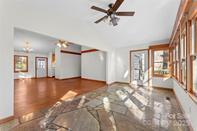 550 Kinross Dr, Flat Rock, NC 28731 - unfurnished living room with lofted ceiling, ceiling fan with notable chandelier, and wood-type flooring