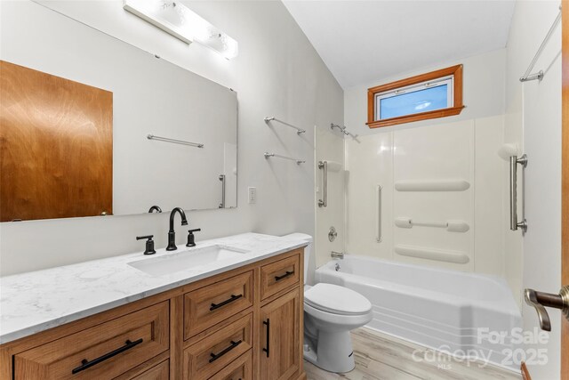 550 Kinross Dr, Flat Rock, NC 28731 - full bathroom featuring toilet, vanity, shower / washtub combination, and hardwood / wood-style floors
