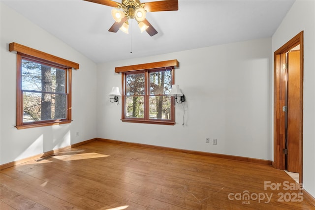 550 Kinross Dr, Flat Rock, NC 28731 - unfurnished room featuring ceiling fan, vaulted ceiling, and light hardwood / wood-style flooring