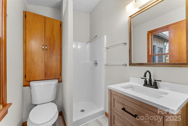 550 Kinross Dr, Flat Rock, NC 28731 - bathroom featuring toilet, walk in shower, and vanity