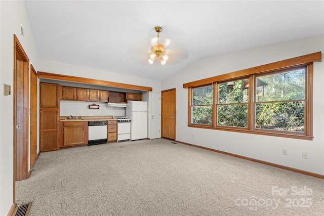550 Kinross Dr, Flat Rock, NC 28731 - kitchen featuring ceiling fan, white appliances, light colored carpet, vaulted ceiling, and sink