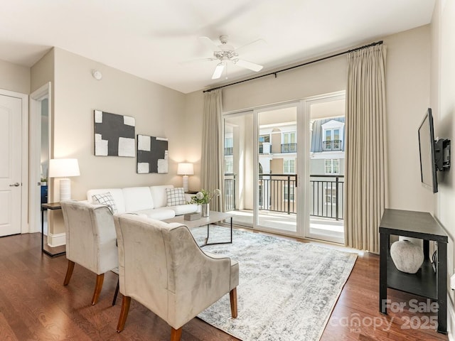 living room featuring dark hardwood / wood-style floors and ceiling fan